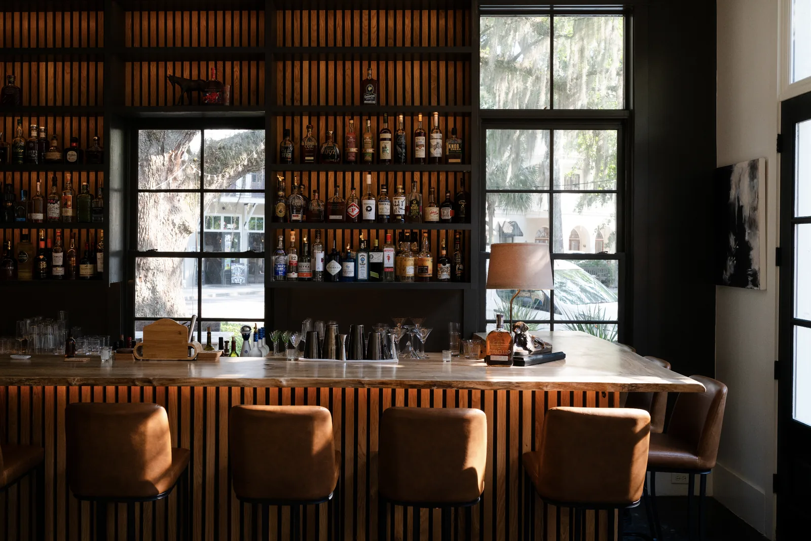 The Criollo bar with leather stools and tall windows