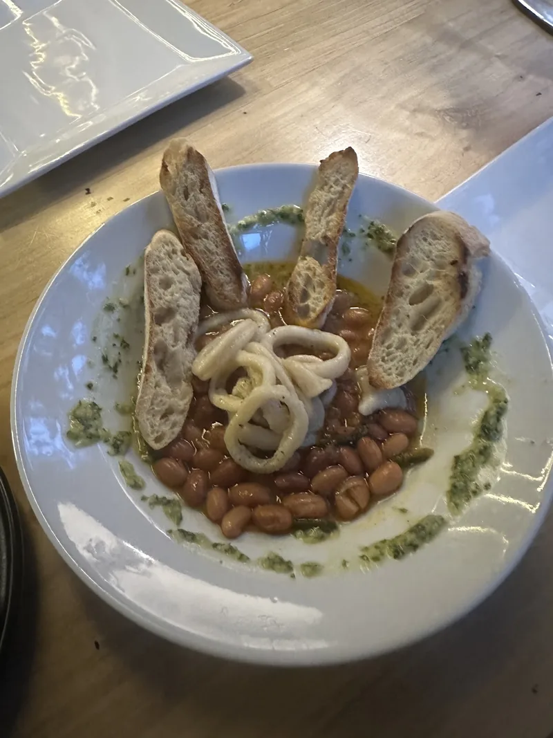 Calamar — squid with brown beans and chimichurri