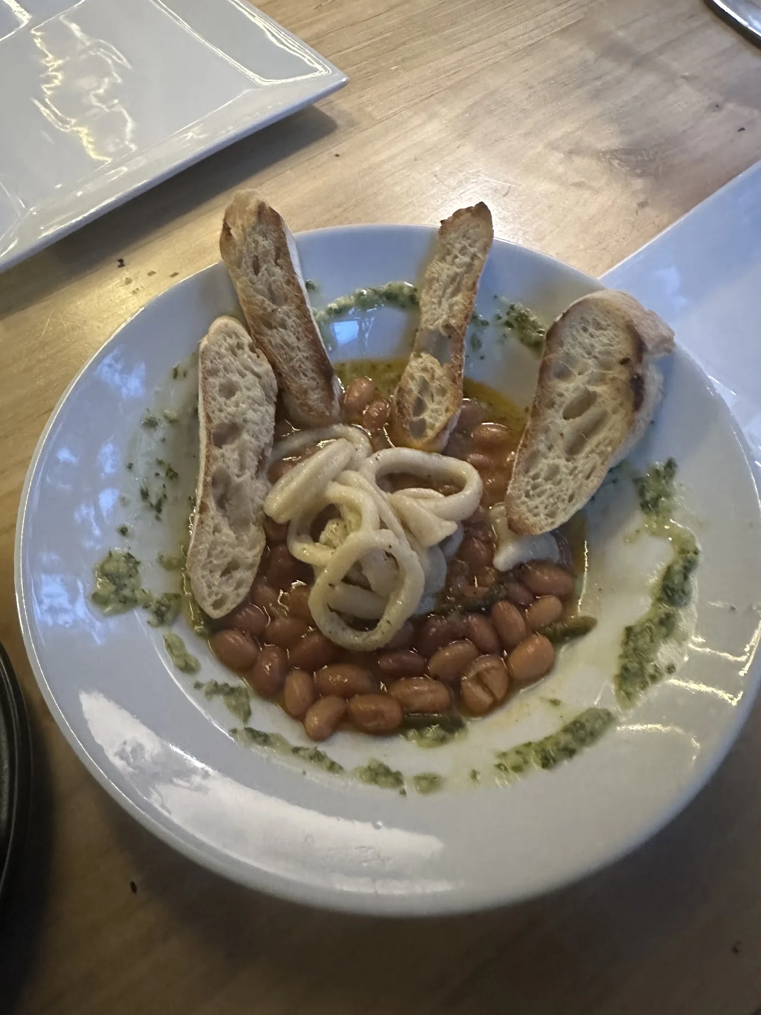 Calamar — squid with brown beans and chimichurri